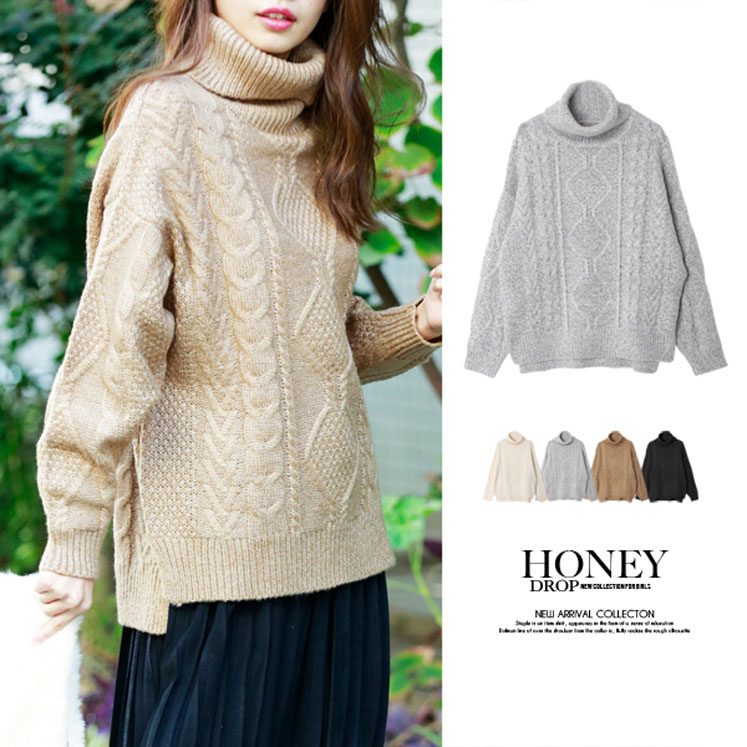 ケーブル編みドルマンタートルニット